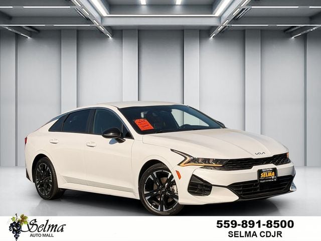 2023 Kia K5 GT-Line in White Pearl — front three-quarter view